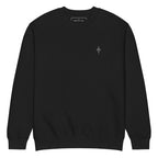 Black crewneck sweatshirt with a small gothic sigil printed on the chest